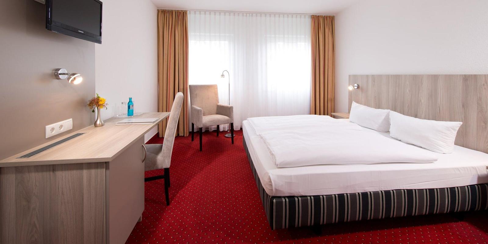 Business Zimmer ACHAT Hotel Frankenthal in der Pfalz Betten